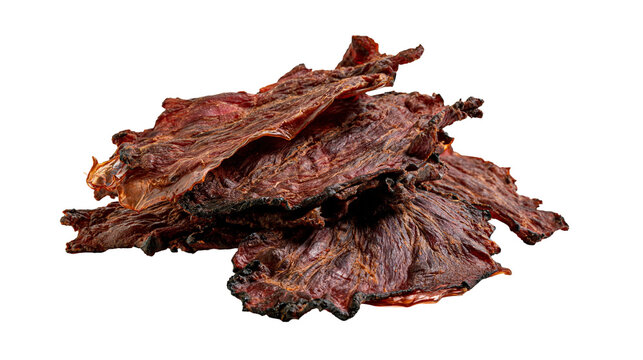 Isolated pile of crispy dried beef jerky pieces with a fibrous texture and rich savory flavor