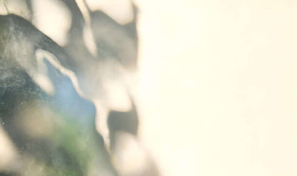 Sunlight and Shadow Play: Abstract patterns of light and shadow dance across a soft, textured surface, creating a serene and contemplative mood.