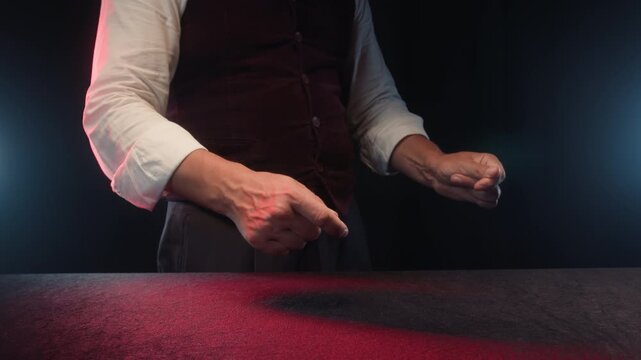 Magic show, Magician performing vanishing wand trick on stage, wow effect magic show, show in casino.