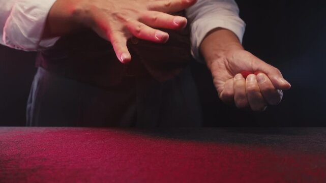 Magic show, Magician man performing sponge ball trick at nightclub, wow effect magic, macro of perfomance, focus.