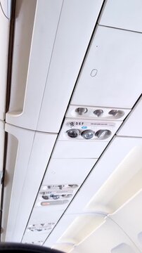 Airplane ceiling panel with vents and light controls
