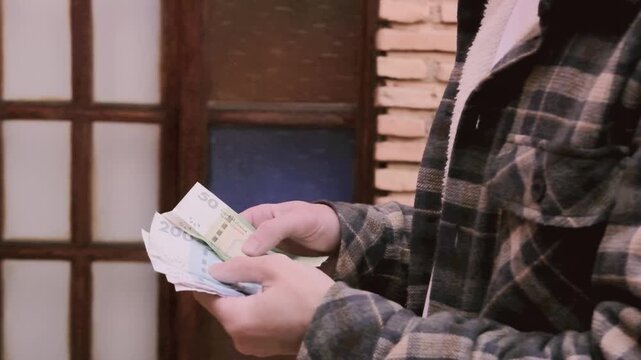 closeup male hands hold Moroccan dirham money, count paper dirham banknotes, concept cash payments, monetary savings, save for vacation, exchange and cashing currency