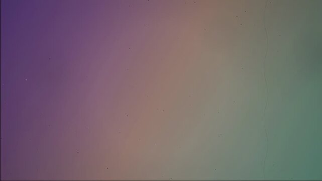 Abstract vintage film grain texture with light leaks and vertical scratches on colorful background