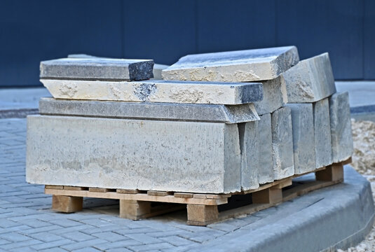 Dismantled curbstones on pallets