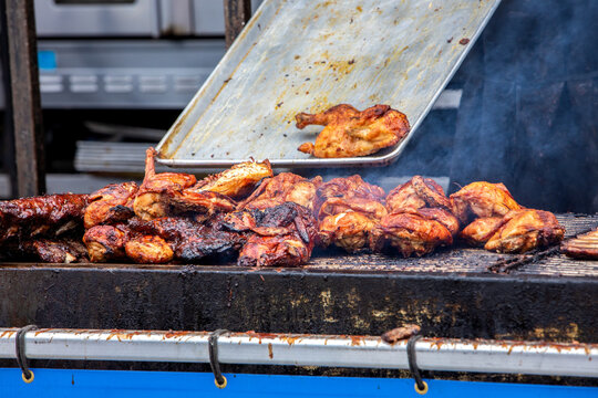 Barbecue Ribs and Chicken on the Grill at a Summer Festival