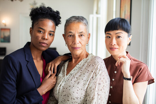 Portrait of confident multigenerational businesswomen in modern office