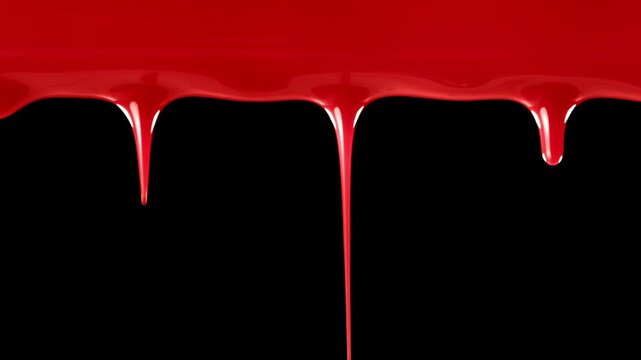 Vivid red blood flowing down over black and green screen. Blood red drops dripping down. Scary bleeding overlay showing frightening violence, an injury, terror, or a spooky Halloween background.