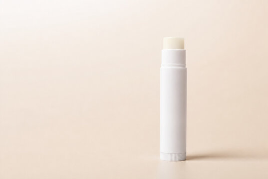 Minimalist Lip Balm Tube Mockup on Beige Background with Copy Space