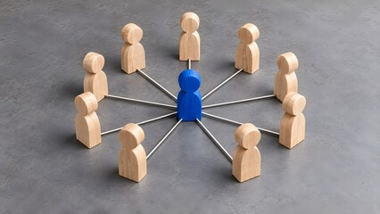 Obraz premium Central Blue Wooden Figure Connected to Team Members Representing Leadership and Business Network