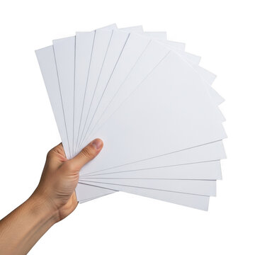 A hand holding a stack of white perforated paper sheets for printer isolated on transparent background
