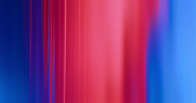 Contrast of red and blue lights illuminate the brilliance of a reflective glass creating a moving gradient of vivid neon colors. Smooth blends of reds and blues abstract background or wallpaper Loop