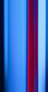 Contrast of red and blue lights illuminate the brilliance of a reflective glass creating a moving gradient of vivid neon colors. Smooth blends of reds and blues abstract background or wallpaper Loop
