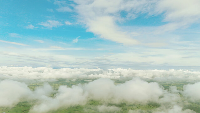 Cirrus clouds drift above sea  fluffy white clouds