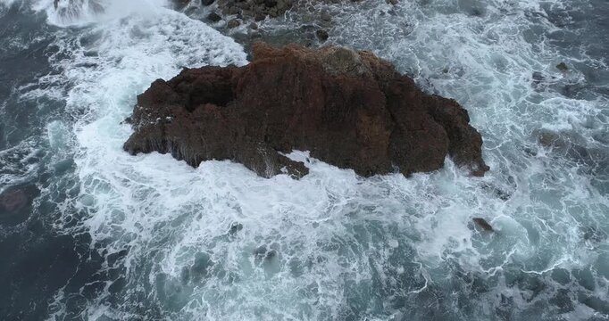 Pull back from sea stack revealing rugged coastline, Palos Verdes