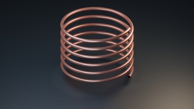 A shiny copper wire coil isolated on a dark gray background for industrial concepts