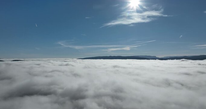 drone flight over the clouds during sunrise fly through the clouds fresh morning an