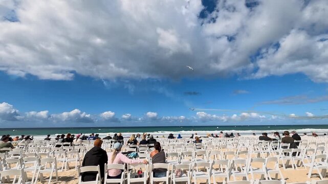 Crowd Watching Airshow with Smoke Trails at Surfers Paradise Beach