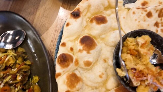 Asian Dining Table with Shan Noodles Prawns and Flatbread