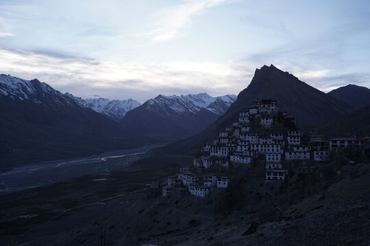 Key Monastery Glowing at Blue Hour Against Himalayan Mountains in Spiti Valley, India.