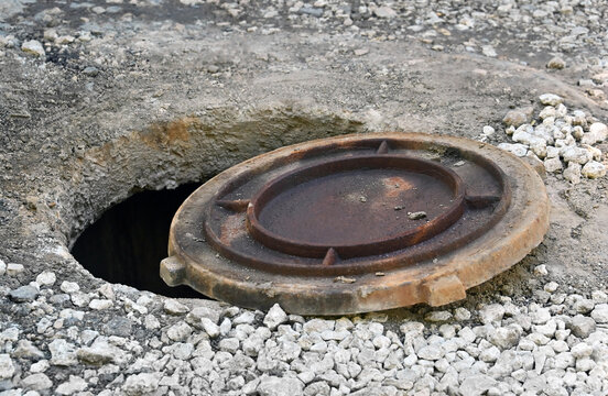 Open manhole cover