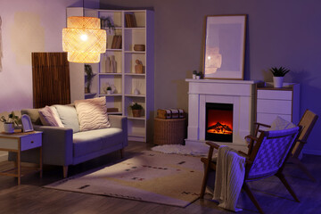 Cozy home interior, hygge lifestyle and relaxation with warm fireplace lighting and comfortable living room furniture in a modern apartment © Pixel-Shot