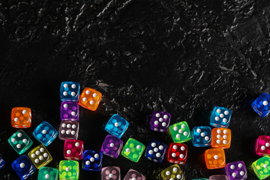 Colorful game dices on black background