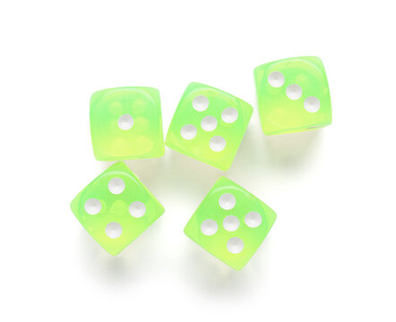Many green game dices on white background