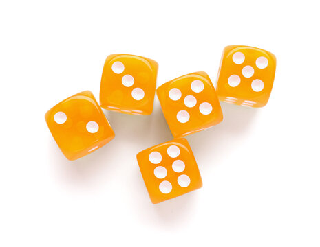 Many orange game dices on white background