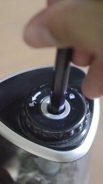 close up of a hand holding a pencil