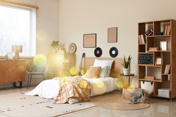Student lifestyle and cozy bedroom interior, teenager room with study area and personal hobbies in a bright home environment with warm morning sunlight © Pixel-Shot