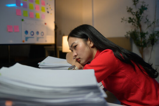 Stressed woman feeling burnout from overwork in office