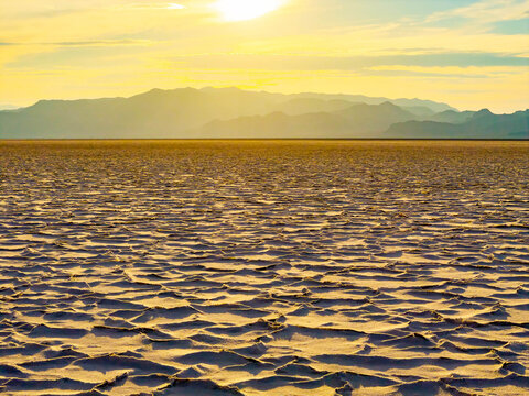 Aerial view of golden sunset illuminating Utah salt flats