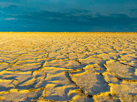 Aerial view of golden sunset illuminating Utah salt flats