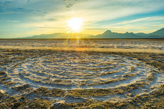 Concentric circular patterns on Bonneville Salt Flats at sunset