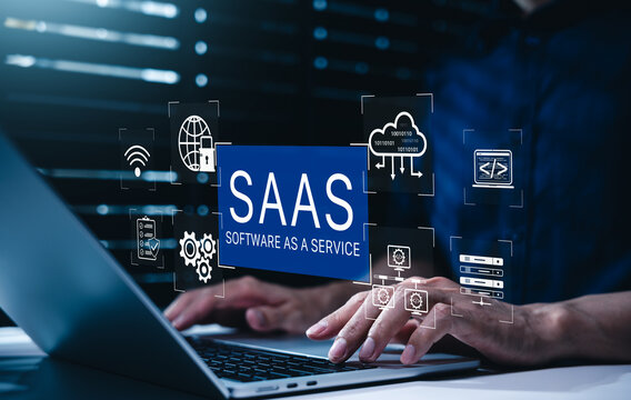SaaS software as a service cloud technology concept. Person typing on laptop with icons of database server, web application programming code, corporate system automation, online subscription platform