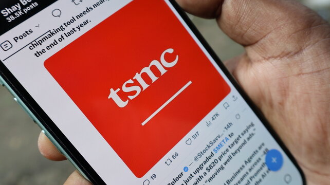 Smartphone screen displaying tsmc logo on social media feed held by hand focusing on semiconductor industry news update. Kolkata, West Bengal, India, September 11, 2026