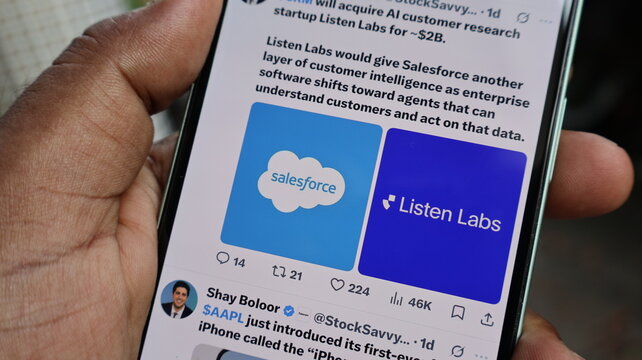Hand holding smartphone showing digital post with salesforce and listen labs company logos on blue app screen display. Kolkata, West Bengal, India, September 11, 2026