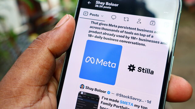 Close view of smartphone screen displaying meta and stilla logos in social feed post about advanced software solutions. Kolkata, West Bengal, India, September 11, 2026