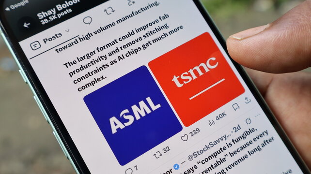 Asml and tsmc logos on smartphone screen for semiconductor manufacturing industry news updates held in hand by male user. Kolkata, West Bengal, India, September 11, 2026