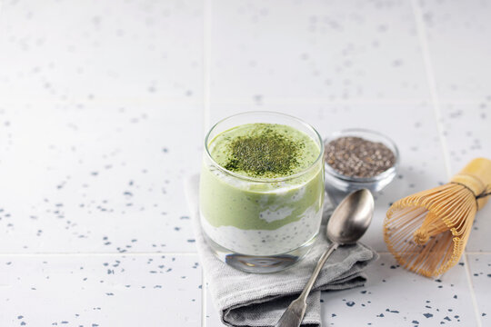 Matcha green tea chia seed pudding in glass. Vegan dessert