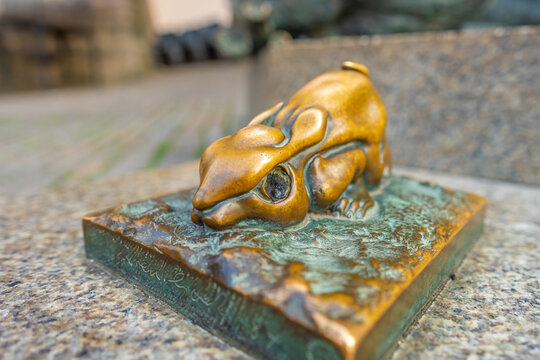 Close-up macro view of the small bronze miniature rabbit statue part of the quirky Durer Hare monument in the old town of Nuremberg