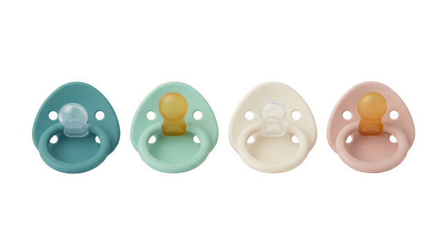 Four baby pacifiers in pastel colors isolated on white