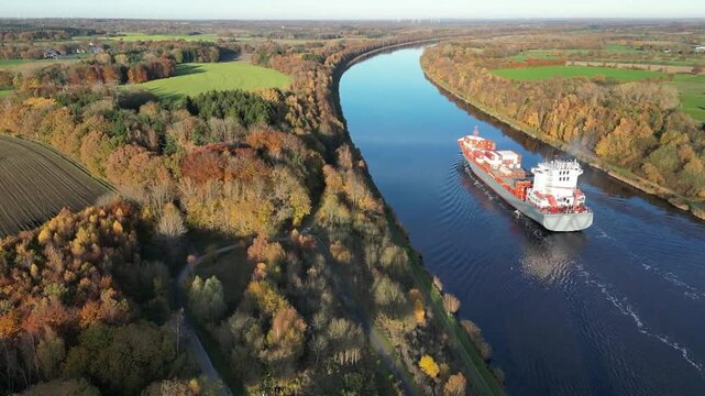 Container ship sails through the Kiel Canal in autumn, NOK, Kiel Canal, Kiel Canal, Schleswig-Holstein, Germany