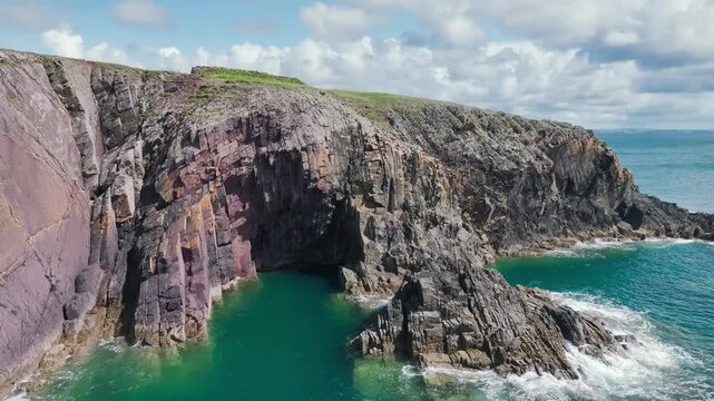 Cliffs over Porthclais from a drone, St Davids, Haverfordwest, Wales, England, United Kingdom