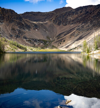 Rocky mountain bowl reflected in a Cathedral Park lake