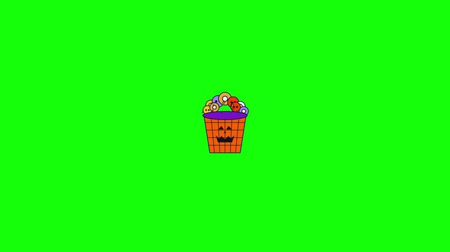 Cute cartoon Halloween pumpkin bucket filled with colorful wobbly eyeballs animation on a green screen background