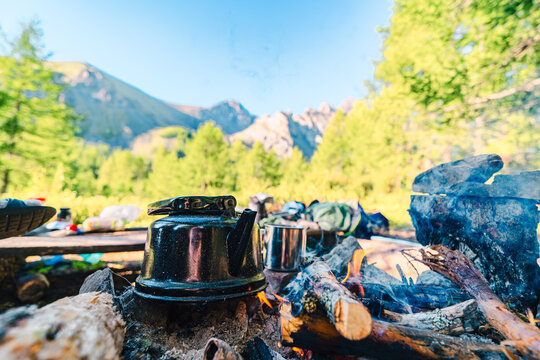 metal kettle near camp fire