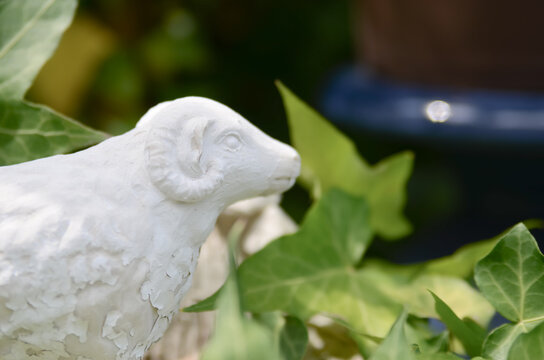 White sheep ornament with green ivy, Year of the Sheep zodiac concept for 2027
