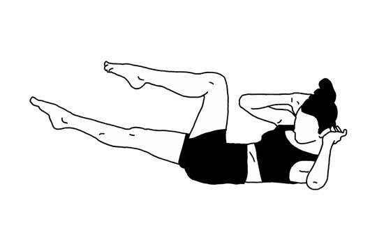 A woman doing pilates bicycle crunch variation
