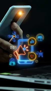 Businessman holding smartphone vertical shot beside glowing social media marketing network icons. Mobile viral engagement, audience outreach campaign promotion, and digital branding idea concept.